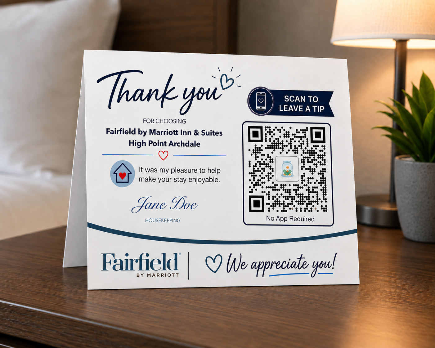 Sample Fairfield by Marriott housekeeping tent card on a guest-room nightstand with a Scan to Leave a Tip QR code